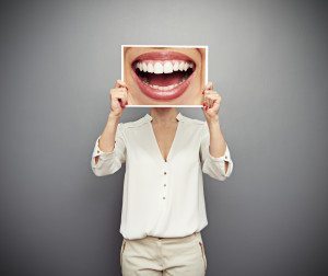 woman holding picture with big smile