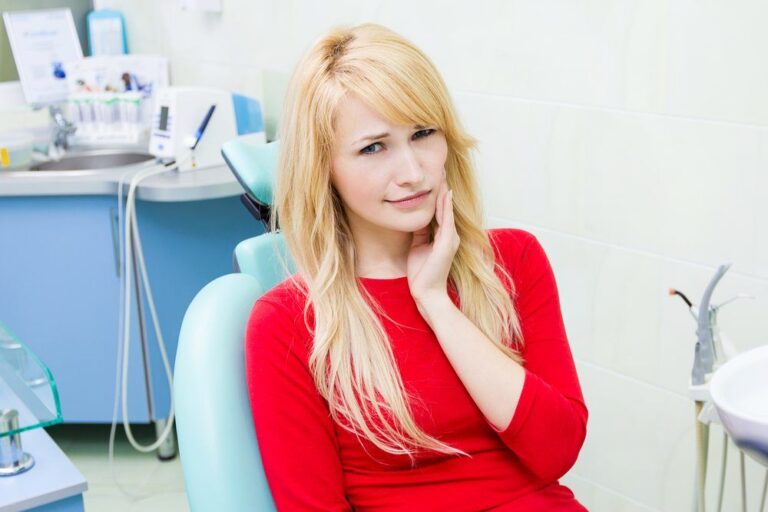 A woman using an oral irrigator