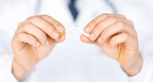 close up of man breaking the cigarette with hands