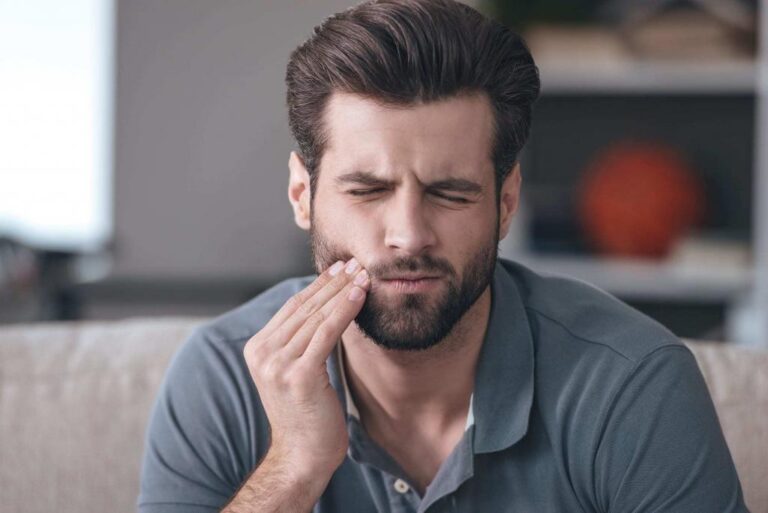 Man Touching His Mouth in Pain, Toothache