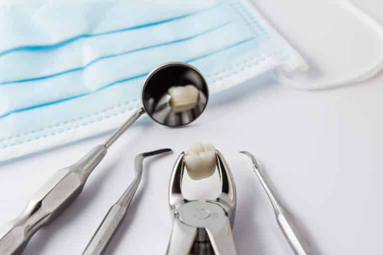 Extracted tooth and dental tools