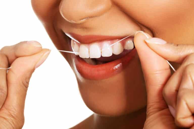 Close-up of woman flossing
