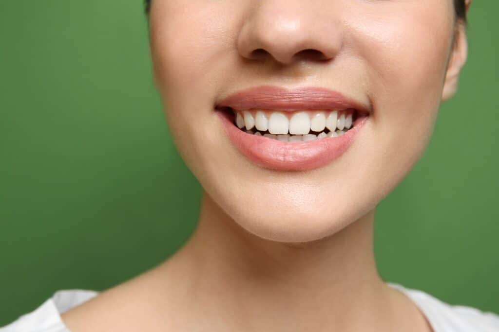 Close-up of young woman smiling