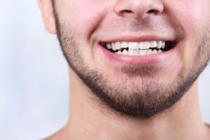 Close-up of smile of young man
